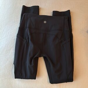 Black Lulu leggings, a little bigger than capri but not full size leggings.